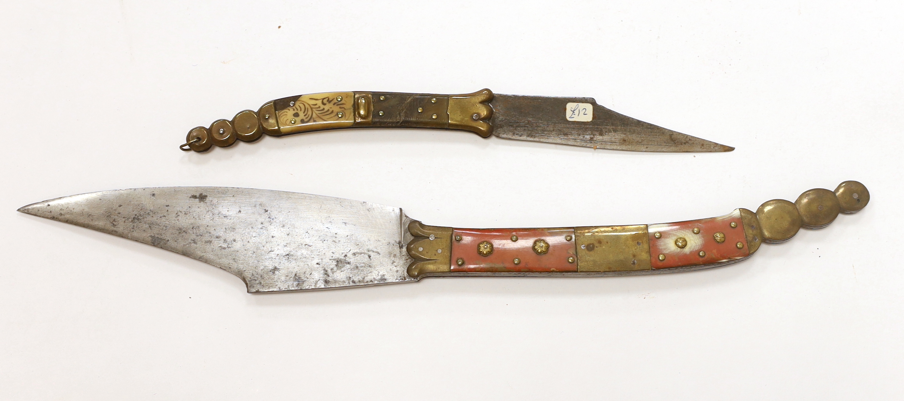 A good Spanish folding knife Navaja, horn and brass handle, the blade of conventional form, 19.3cm, and another similar smaller knife